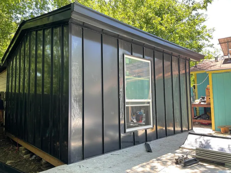 Black standing seam metal wall panels for Roof Inspection in New Burlington