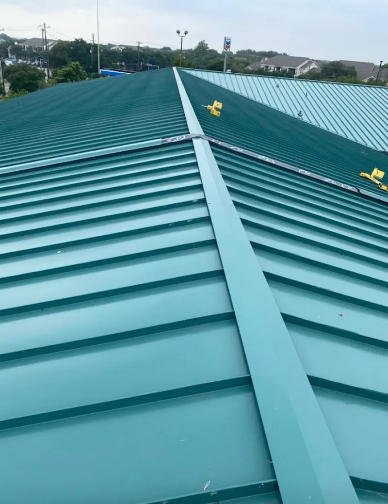 Green commercial metal roof ridge and valley for Metal Roof Repair in New Burlington