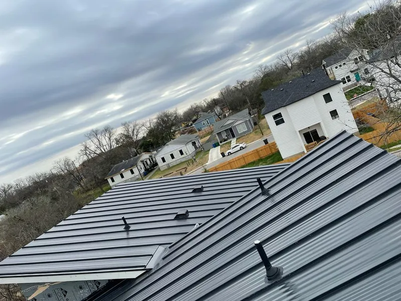 Standing seam metal roof panels with vents for Skylight Repair in New Burlington